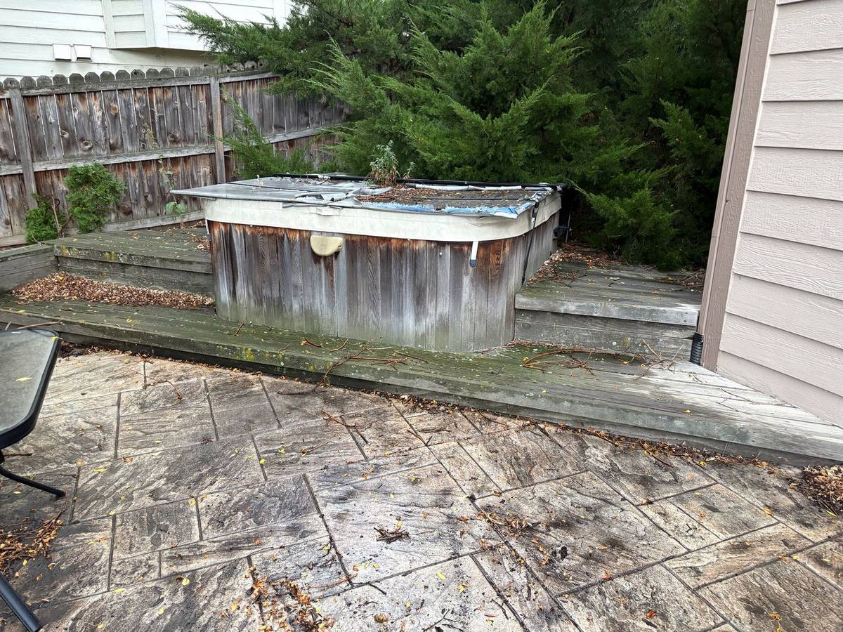 Backyard deck built around an old hot tub before demolition, Arvada