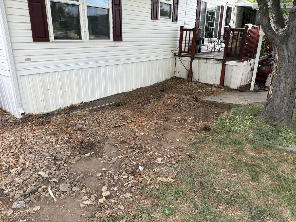Front of the home after the ramp was removed and the pad cleared