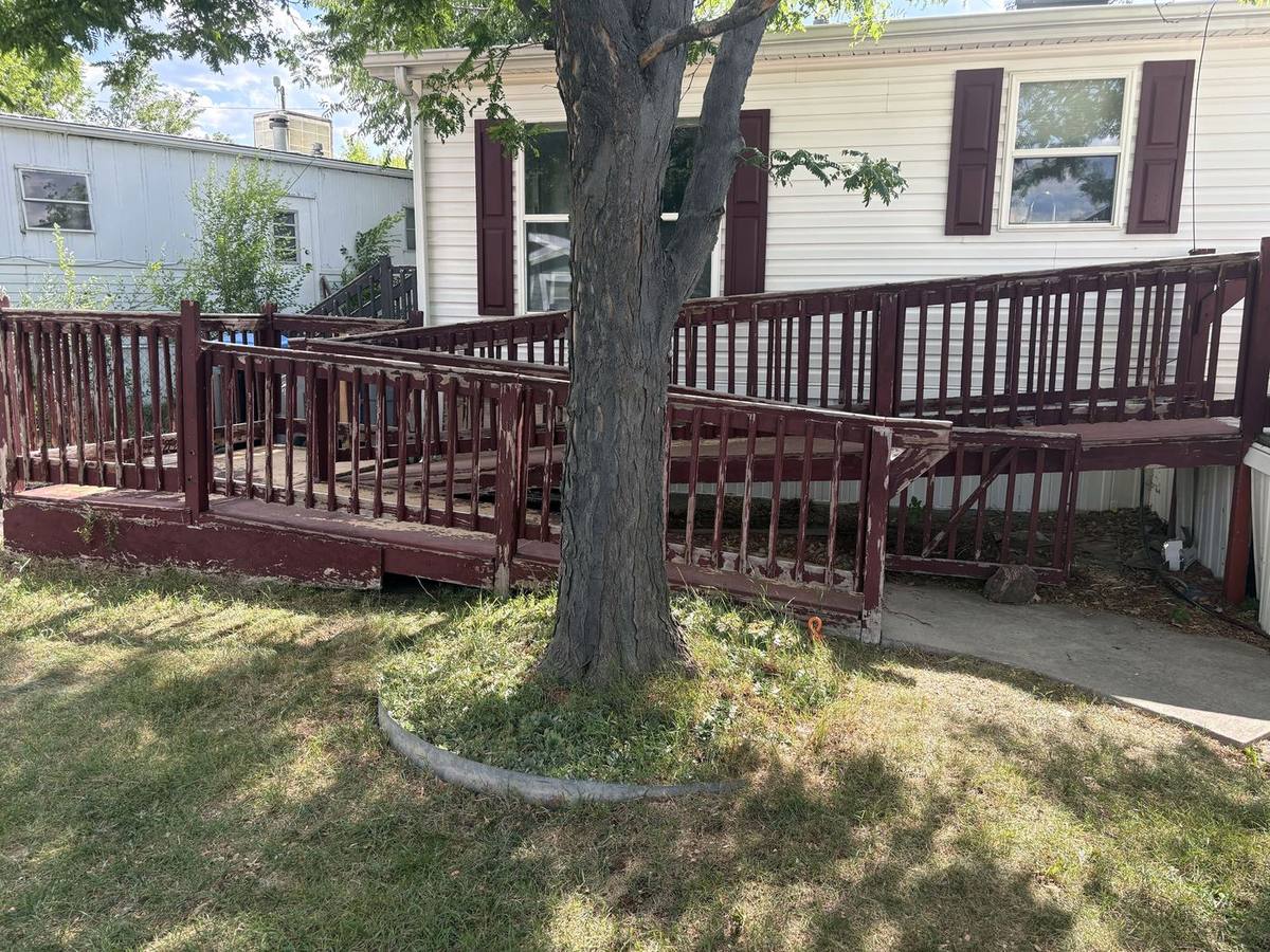 Wooden wheelchair ramp on a manufactured home in Golden before removal