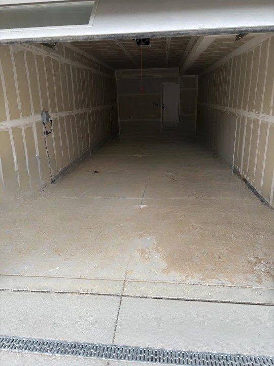 Same Denver garage swept clean and empty after construction debris cleanout